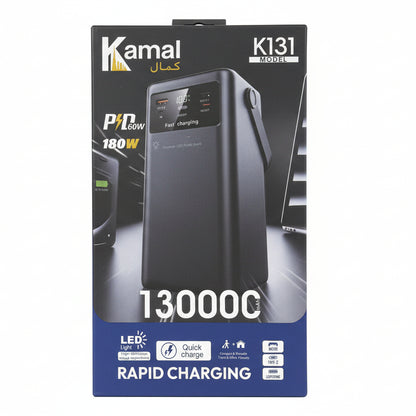 Kamal power bank packaging held in front of a store shelf with various products.